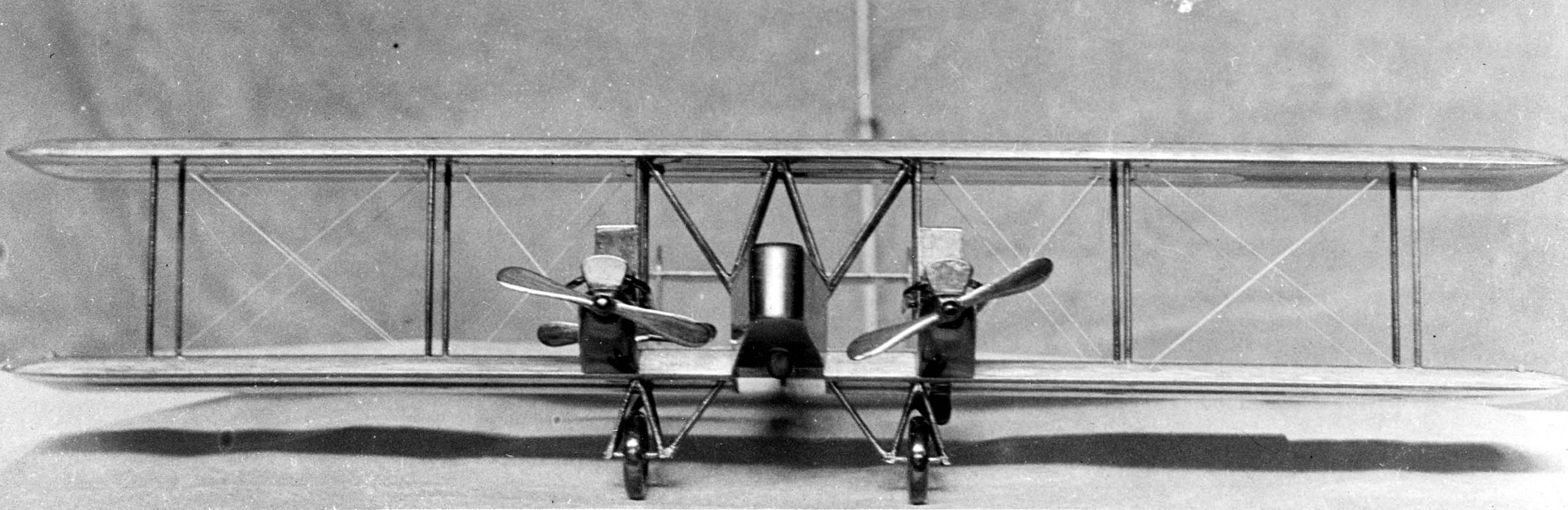 Symmetrical head-on frontal view of the Elias XNBS-3 wooden wind-tunnel bomber model detailing wing rigging and twin engine nacelles.