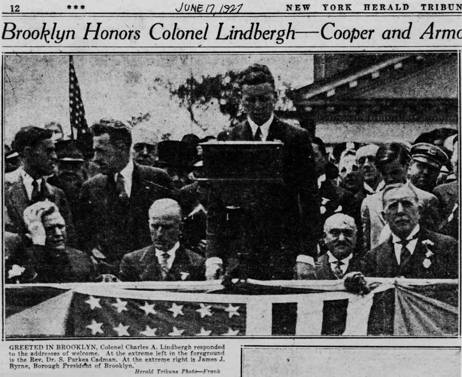 A New York Herald Tribune newspaper clipping dated June 17, 1927, with the headline "Brooklyn Honors Colonel Lindbergh."