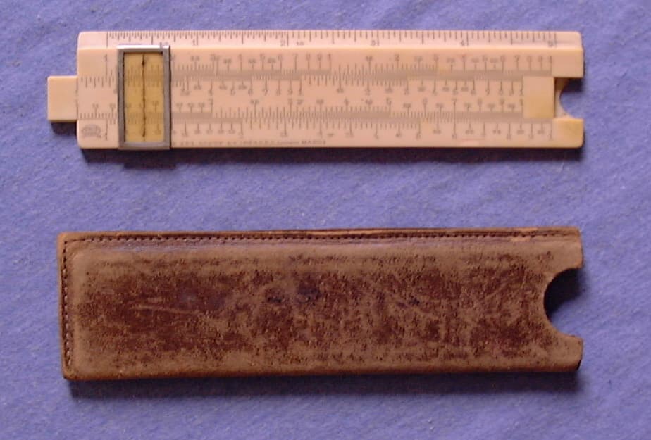 A vintage celluloid pocket slide rule with cursor runner and its original worn brown leather protective slipcase.