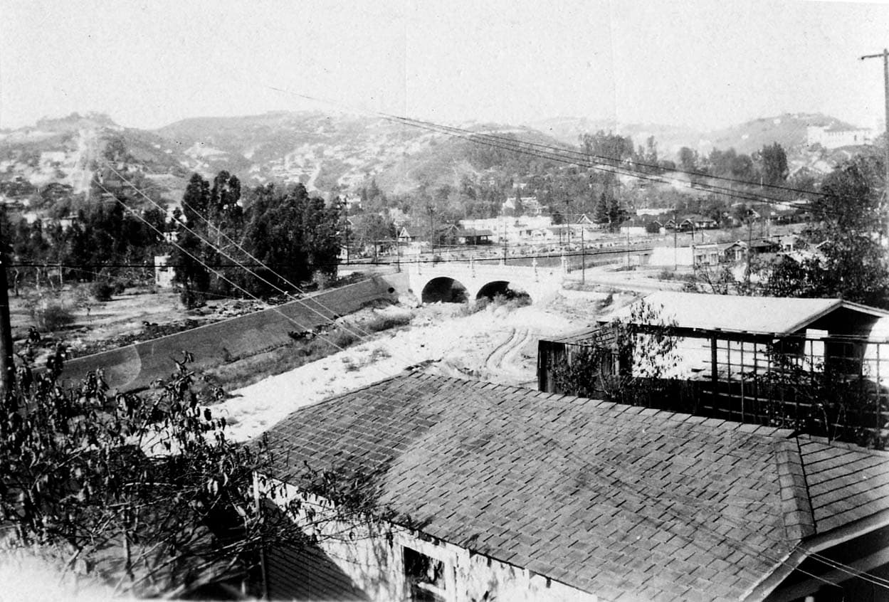 A quiet residential park area in Los Angeles, California, captured by Donald A. Hall Sr. in 1927, featuring green lawns and mature trees.