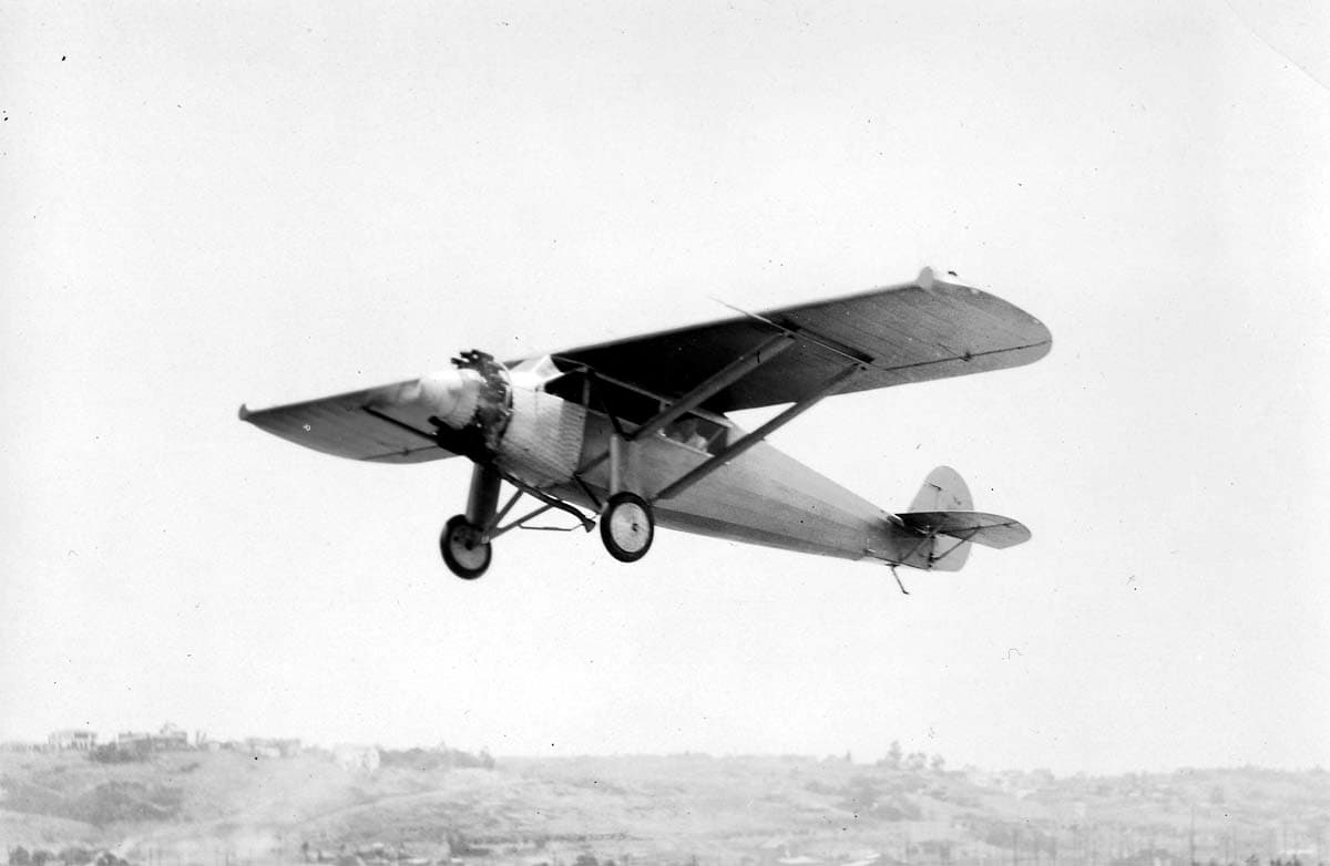 An air-to-air or low-angle photograph of the sleek Ryan B-1 Brougham passenger aircraft lifting into the air designed by Donald A Hall which was influenced by the Spirit of St. Louis (model NYP)