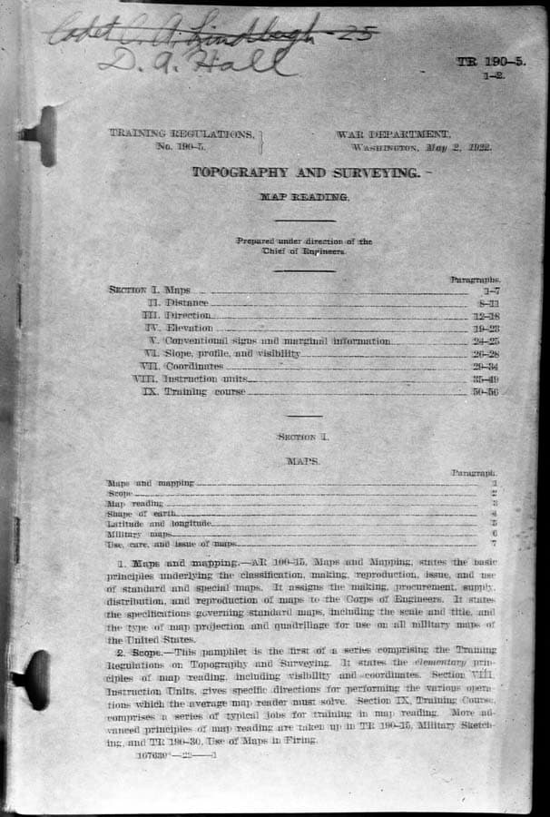 The cover of a War Department Topography and Surveying training manual, showing Cadet C.A. Lindbergh's name crossed out and D.A. Hall written below it.