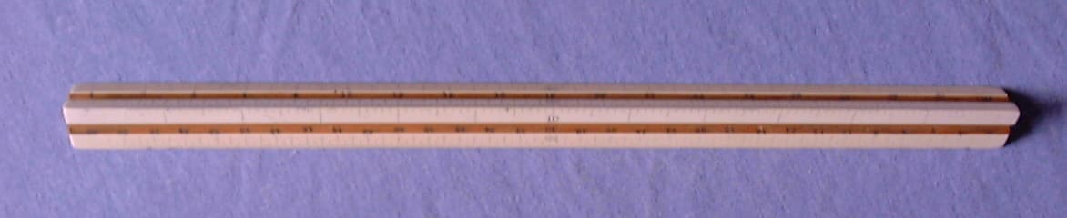 A professional architectural and engineering triangular boxwood drafting scale ruler used for aircraft structural design.