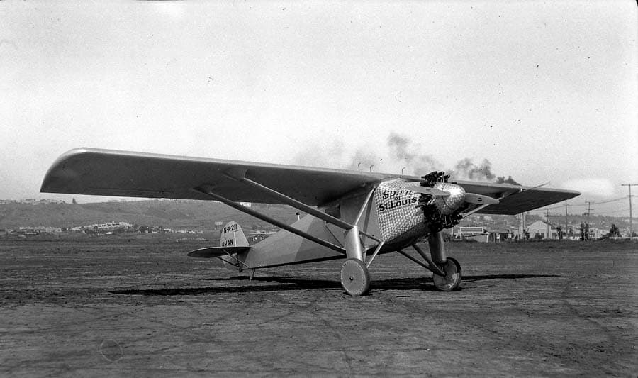 Three-quarter view of the Spirit of St. Louis starboard side showing damascened cowl and right cockpit door.
