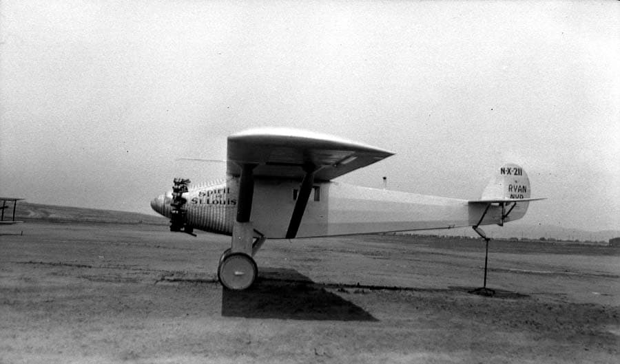 Left profile photograph of the Spirit of St. Louis on Dutch Flats with tail elevated on a testing trestle.