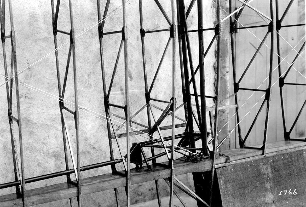 Macro technical photograph plate 5766 showing internal spruce ribs, wooden spar, and control linkage of the Hall X-1 wing.