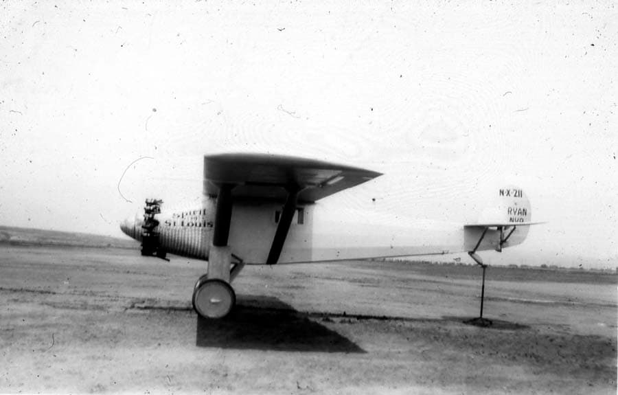 Left side profile view of the Spirit of St. Louis on tail trestle during weight-and-balance center-of-gravity tests.