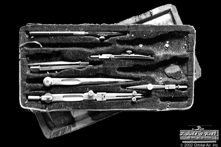 Fitted velvet-lined case containing Donald A. Hall's German silver and steel precision drafting compasses and ruling pens.