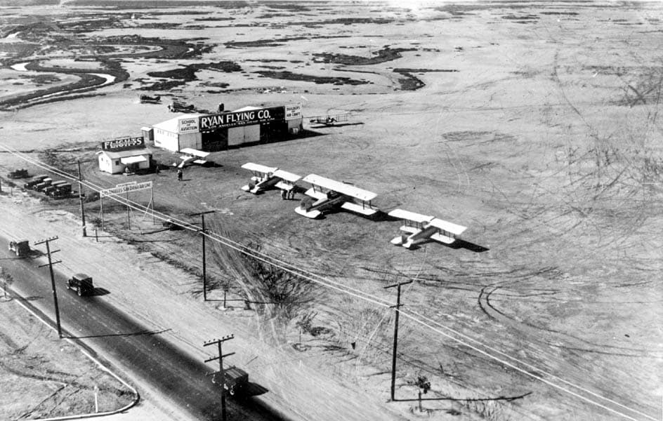 Elevated aerial photograph of Dutch Flats airfield in San Diego showing the Ryan Flying Co. hangar and parked biplanes.