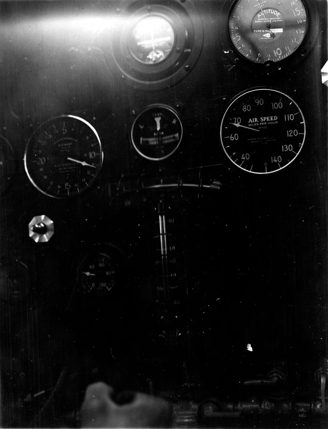 In-flight cockpit instrument panel of the Spirit of St. Louis showing airspeed at 98 mph and altimeter at 1,100 feet.