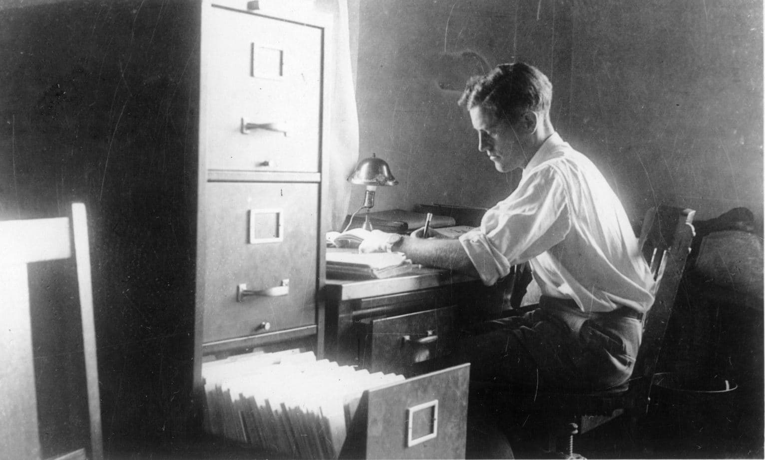 Aeronautical engineer Donald A. Hall working at his desk