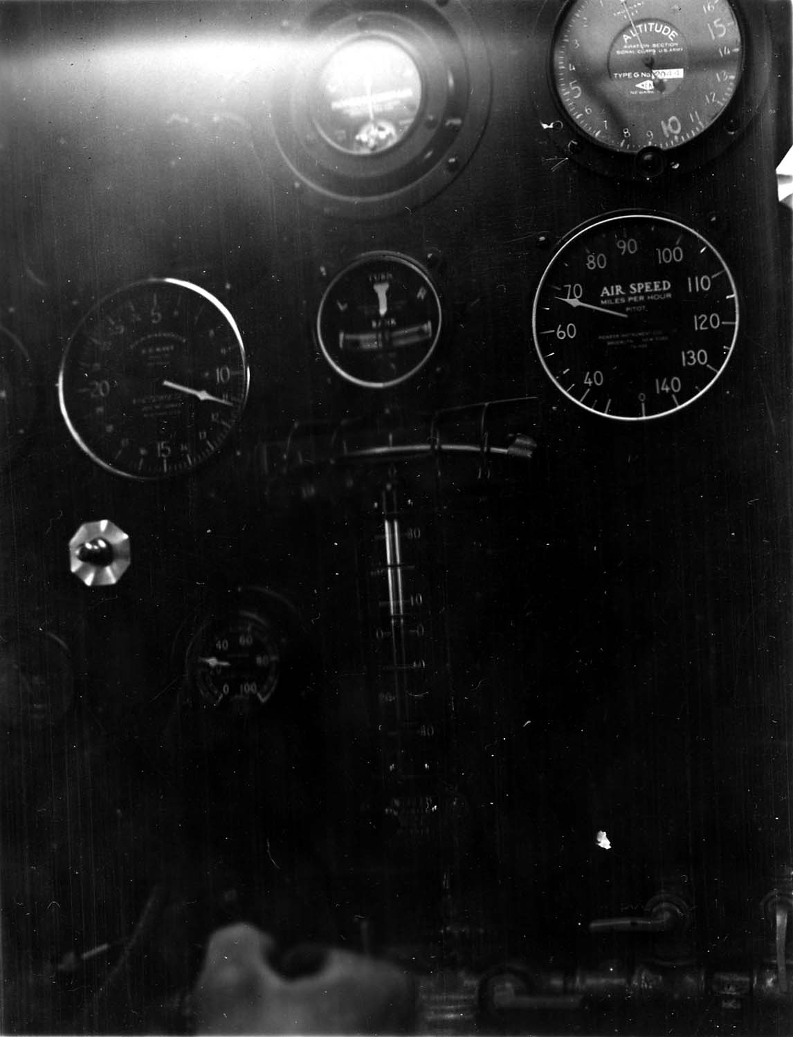 In-flight cockpit instrument panel of the Spirit of St. Louis showing airspeed at 98 mph and altimeter at 1,100 feet.