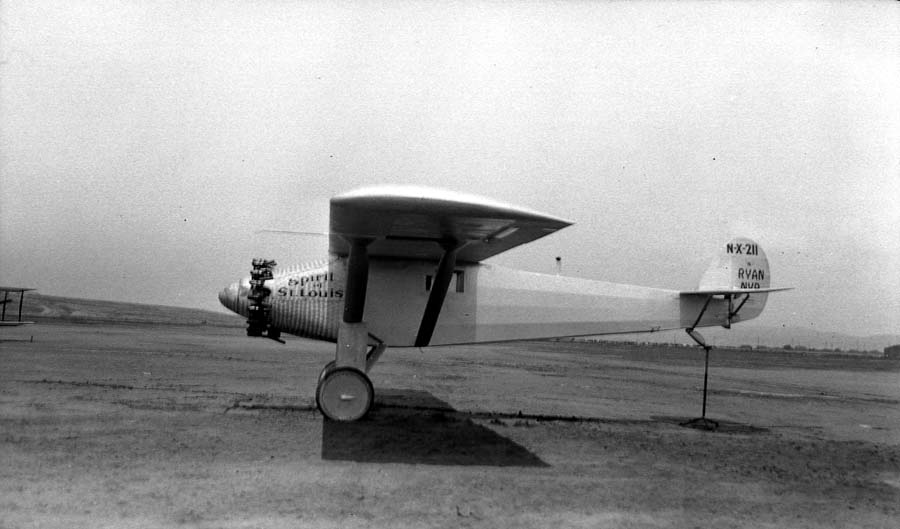 Side photograph of the Spirit of St. Louis aircraft with designation: N-X-211. During April 1927, Donald A. Hall photographed the plane during the Center of Gravity tests. The plane was named Model NYP by the Chief Engineer. Part of a series that needed to be completed for the pilot, Charles Lindbergh