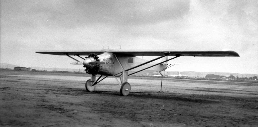 Front photograph of the Spirit of St. Louis aircraft at Dutch Flats, San Diego, California with San Diego, California in the background. Photo taken in April 1927 by Chief Engineer Donald A. Hall with elevated tail for the Center of Gravity test.