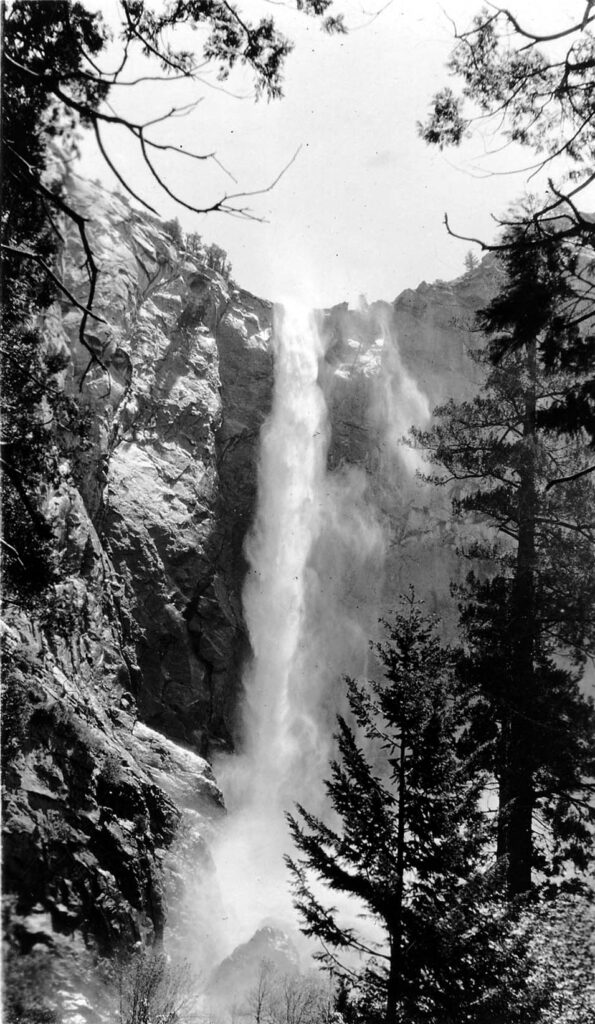 Vintage black and white photograph of an waterfall in Yosemite valley. Taken in California by aviation engineer Donald Hall.
