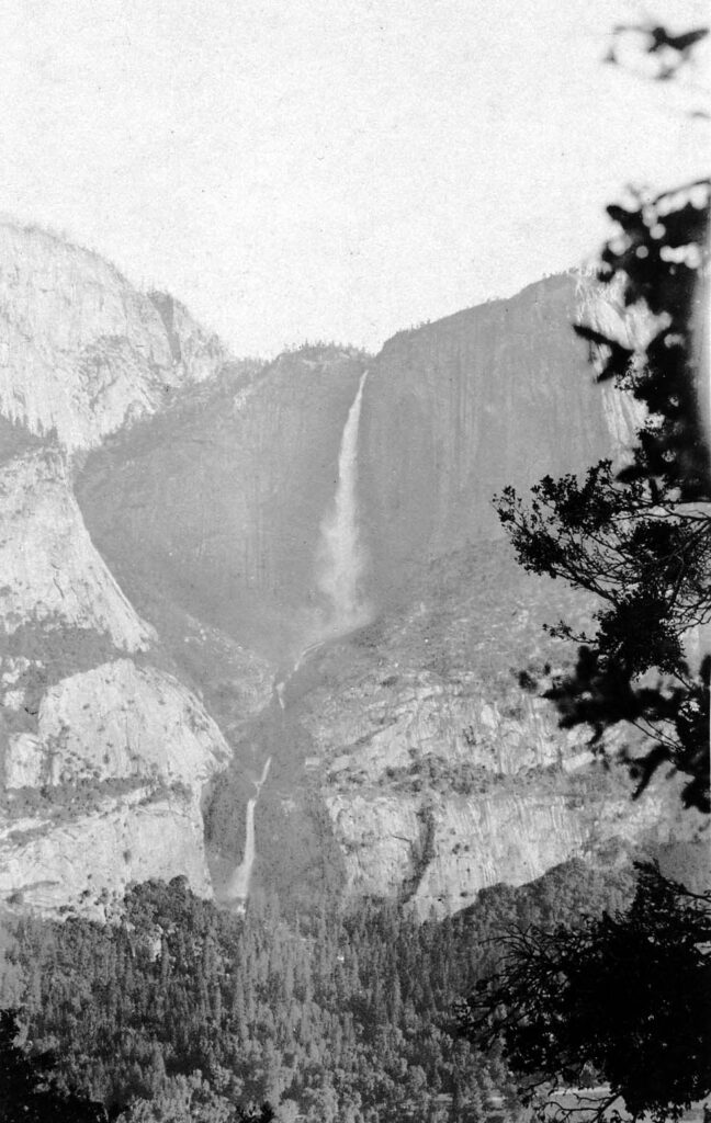 Vintage black and white photograph of Yosemite waterfall from across the valley. Taken at Yosemite National Monument, California by aircraft engineer Donald Hall.