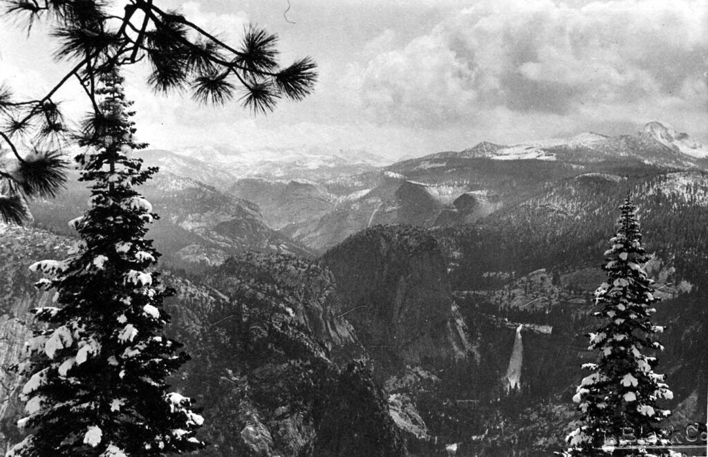 A vintage black and white photograph of the surrounding valley in Yosemite national monument, California.