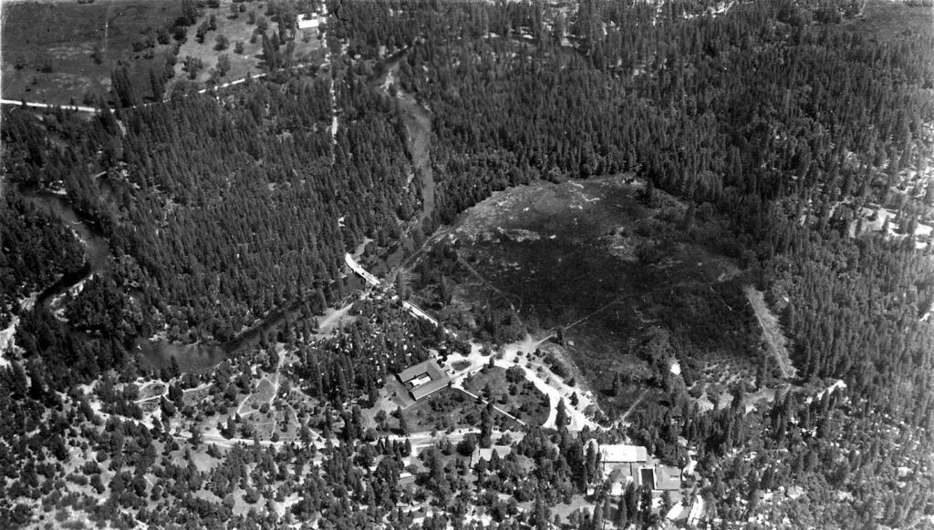 A vintage black and white photograph of Yosemite national monument village, in California by pioneer aviation engineer Donald A. Hall.