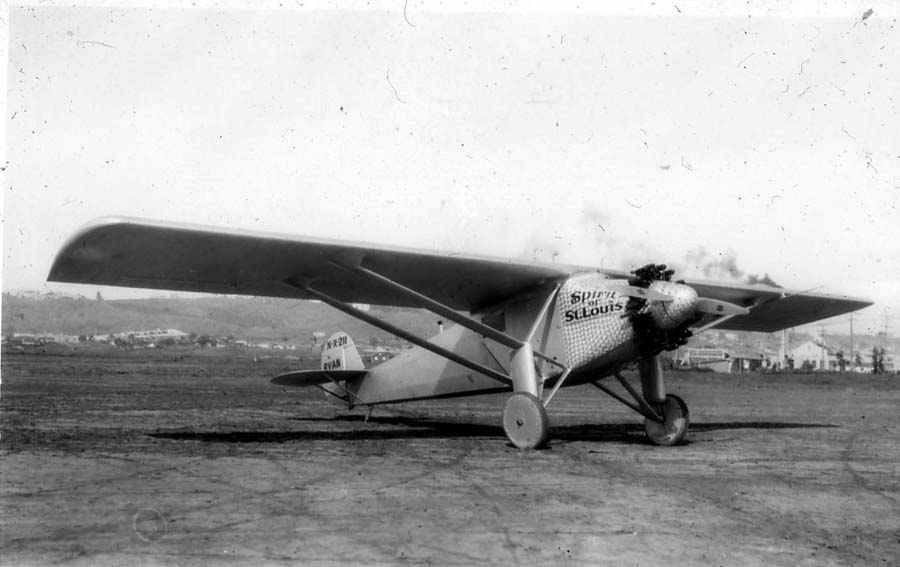 A vintage black and white photograph of the Model NYP Spirit of St Louis aircraft from the front with all original gear at Dutch Flats airfield in San Diego, California in 1927. The airplane that Charles Lindbergh flew from New York to Paris.