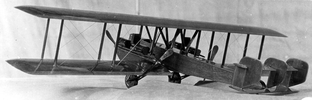 Vintage professional black and white photograph of a wooden model bi-plane bomber designed by Donald Hall.  This design won an award for the designer in Dayton, OH in 1922.