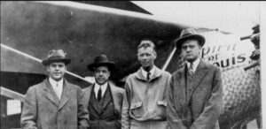 Vintage photograph of Harry Knight, Harold Bixby, and the newsppaper publisher of the Globe-Democrat: Lansing Ray with aviation pilot Charles Lindbergh